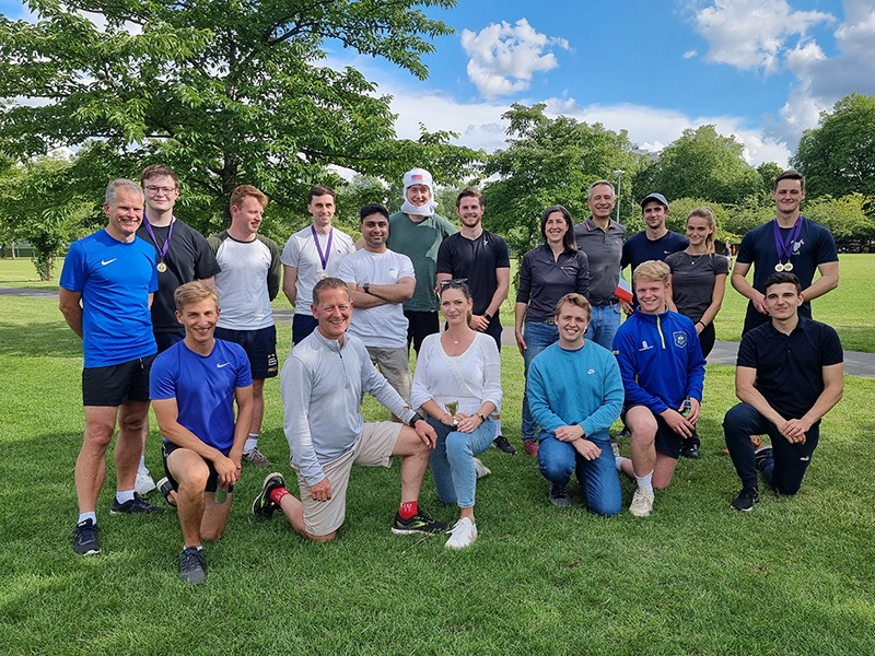 Silverpeak team wearing athletic attire posed together in a park